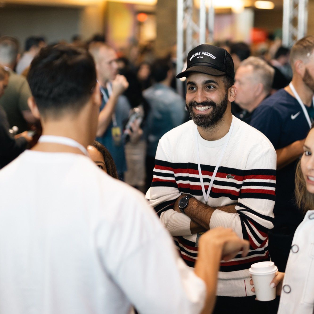 Man smiling at another man