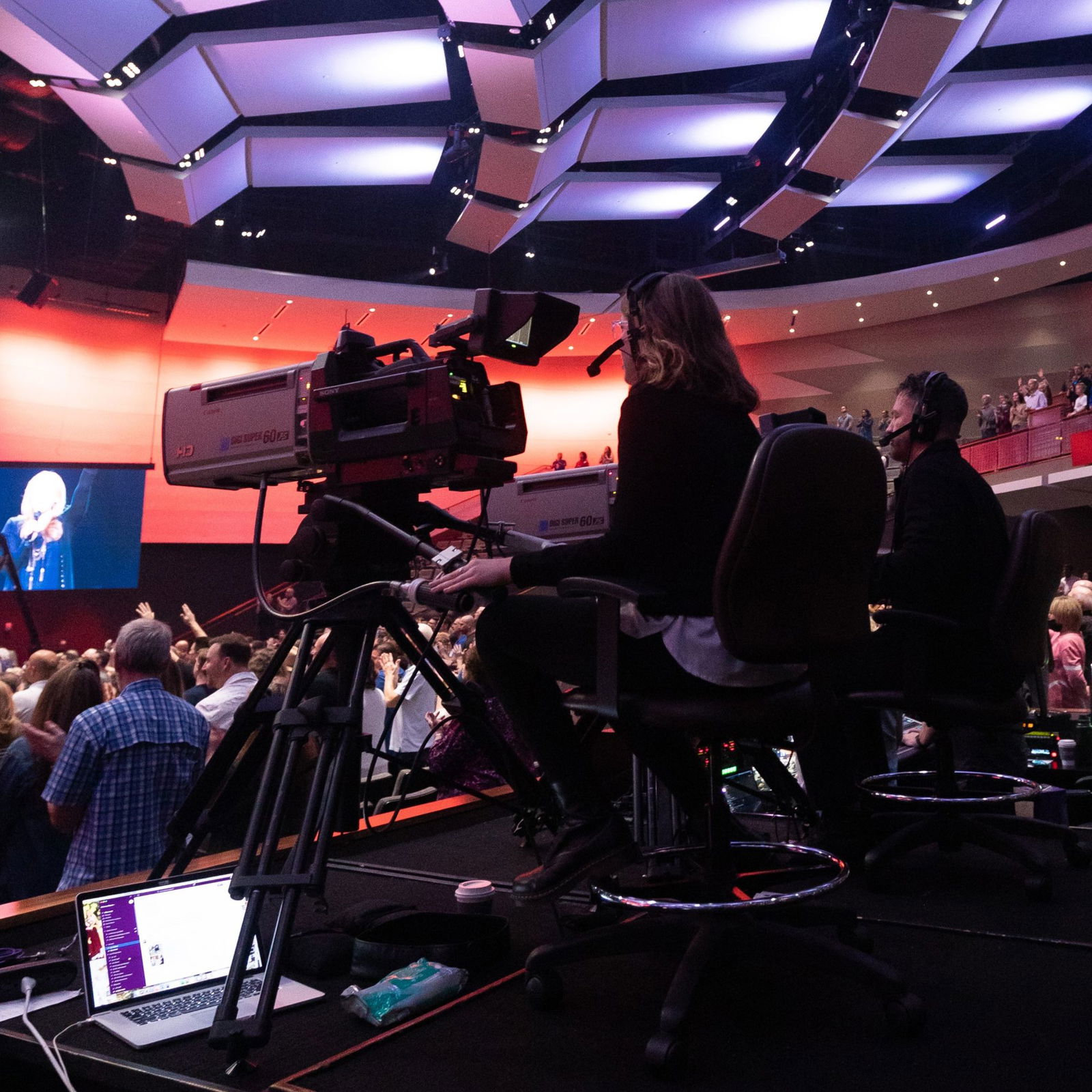 Woman on taking video on large camera